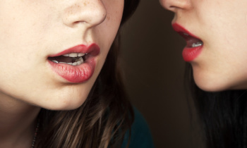 Two Young Women Gossiping