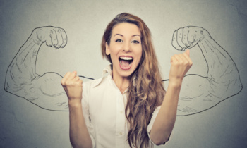 happy woman exults pumping fists ecstatic celebrates success