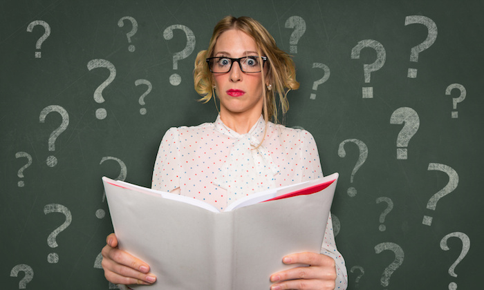 Reading a self help book with blank space assistance questions instruction advice question mark confused learning