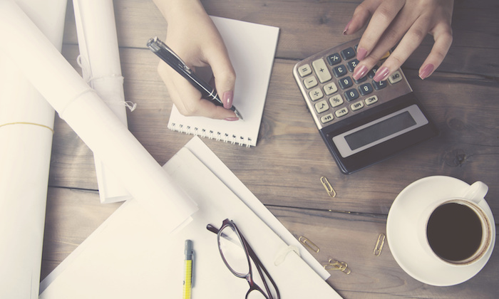 woman hand calculator and pen