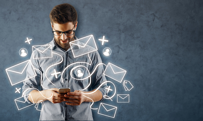 Man using smartphone with email network