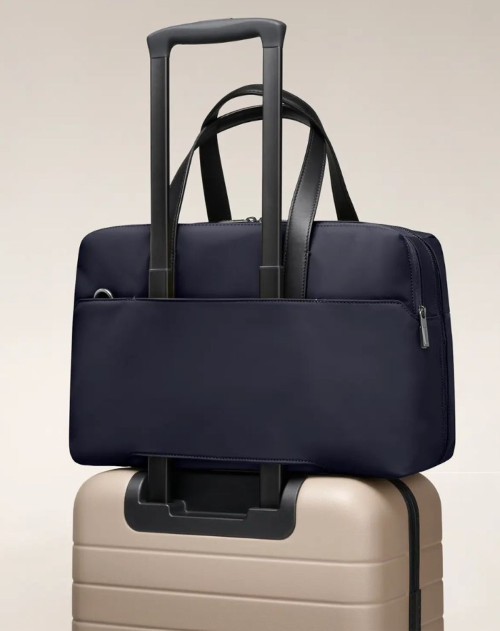 Luggage with bag stacked on top. 
